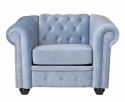 Niebieski pikowany fotel Chesterfield